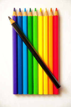 Background of color pencils in a variety of colors and a sharpener.の写真素材