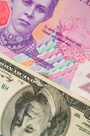 Money background. Ukrainian hryvnia with dollarsの写真素材