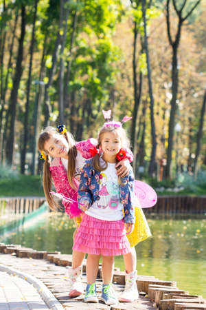 Happy laughing girl on grass. Smiling child outdoorsの写真素材