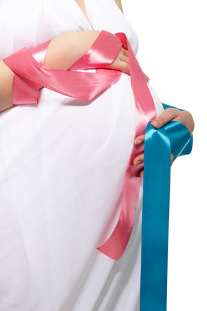 Pregnant Woman touching her belly. Happy Pregnant middle aged mother at home. Female holding her tummy. Healthy Pregnancy concept, Parenthoodの写真素材