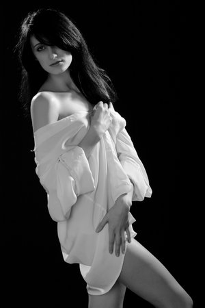 Sexy fit naked woman with healthy clean skin , isolated on black backgroundの写真素材