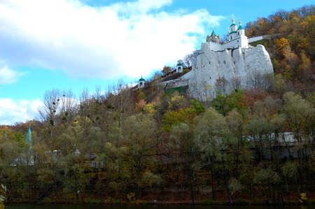 Monastery and church. Aumnal colored foliage of oak tree. Ukraine. National parkの写真素材