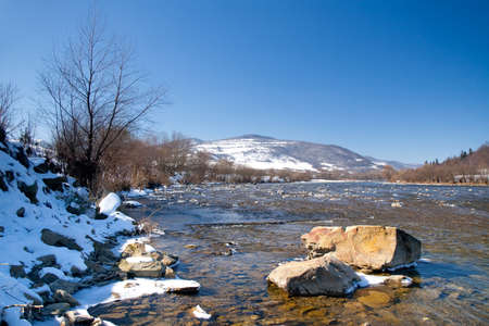 Beautiful landscape of the Carpathian Mountains National Park in Ukraine, with clear water of a wonderful river, blue sky as a copy space.の写真素材