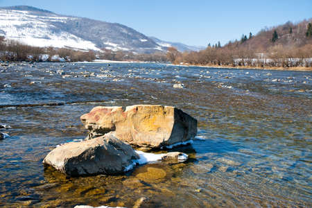 Beautiful landscape of the Carpathian Mountains National Park in Ukraine, with clear water of a wonderful river, blue sky as a copy space.の写真素材