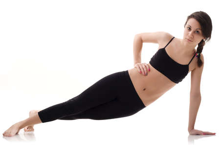 Young, fit and beautiful brunette woman in sportswear isolated on grey. Health care, diet, sport and fitness concept.の写真素材