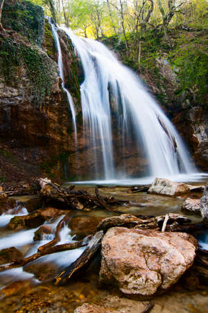 Beautiful landscape nature waterfall in the countryside in the rainforest, view of the Crimean waterfall. Pure and wonderful nature of Crimea. Ukraine, territory occupied by the Russian Federation.の写真素材