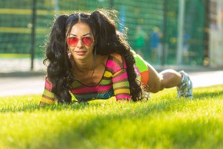 Active lifestyle. Fitness woman exercising outdoorsの写真素材