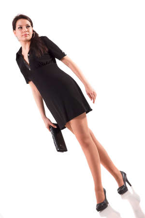 Full body Young woman with apron with fingers crossing and wishing the best on isolated backgroundの写真素材