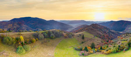 Ukraine. Sunrise shines in the Carpathians, colored fog spreads over the valleys and lowlands of the mountain range, golden prairies are very dazzlingly beautiful.の写真素材