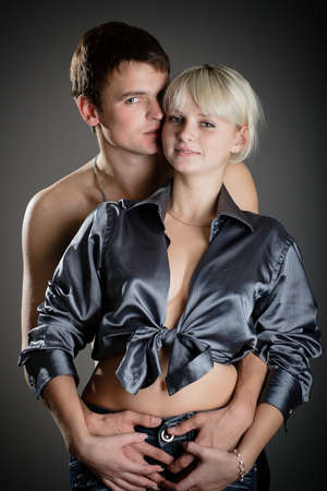 Close up of happy middle-aged man and woman kissing with fondness. Their eyes are closedの写真素材