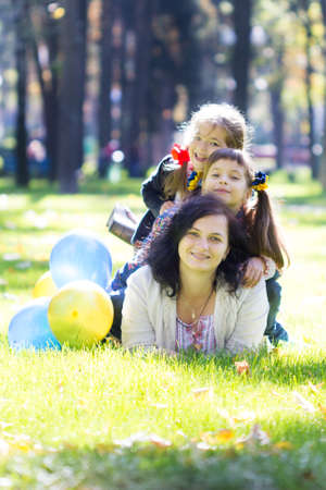 Happy laughing girl on grass. Smiling child outdoorsの写真素材