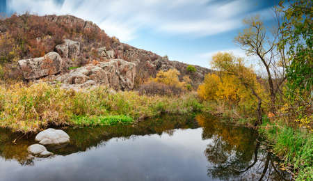 A small wonderful lake along a picturesque river flowing through a beautiful canyon. Huge hatches are in the water. Ukraine.の写真素材
