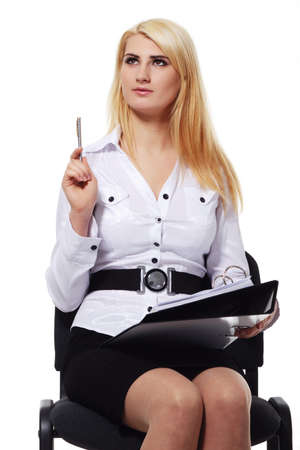 Stylish young businesswoman writing isolated on white backgroundの写真素材