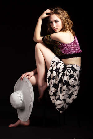 beautiful young girl in a short green dress and black stockingsの写真素材