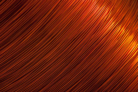 Copper wire for electronics close-up with a focus on the center and blurred edges of the right and left. Designed for the production of electronic components in the electrical industry.の写真素材
