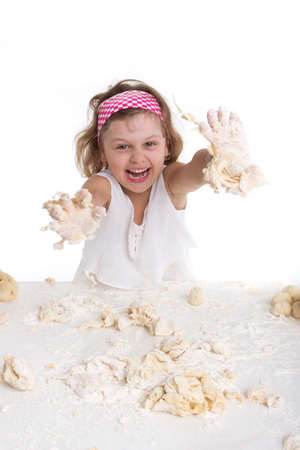 cooking and people concept - girl smiling chef with kitchen utensils, isolated on a white background.の写真素材