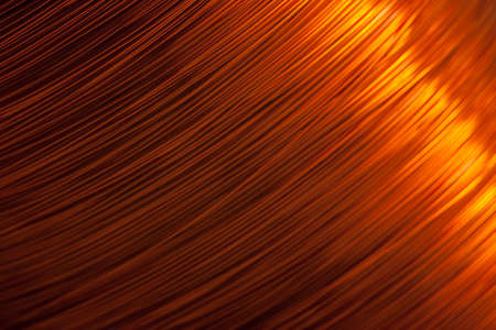 Copper wire for electronics close-up with a focus on the center and blurred edges of the right and left. Designed for the production of electronic components in the electrical industry.の写真素材