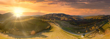 Ukraine. Sunrise shines in the Carpathians, colored fog spreads over the valleys and lowlands of the mountain range, golden prairies are very dazzlingly beautiful.の写真素材