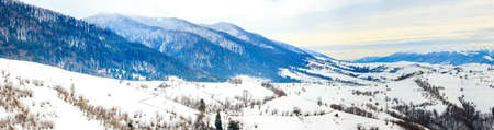 Mountain peak with snow blow by wind. Winter landscape. Cold day, with snow.の写真素材
