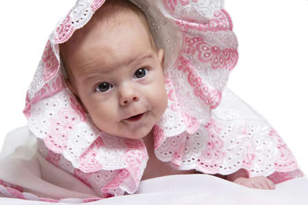 Baby girl After Bath Wrapped in Red Towel Laying and Posingの写真素材