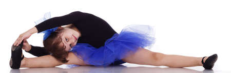 Little dancer in a beautiful blue dress, isolated on a white backgroundの写真素材