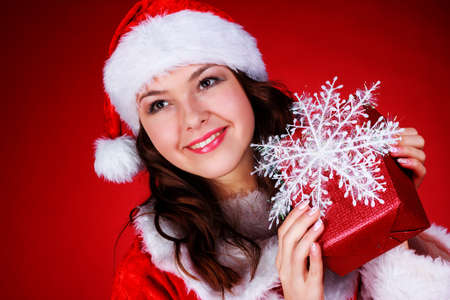 Portrait of beautiful sexy girl wearing santa claus clothes, studioの写真素材