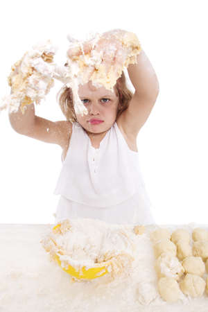 cooking and people concept - girl smiling chef with kitchen utensils, isolated on a white background.の写真素材