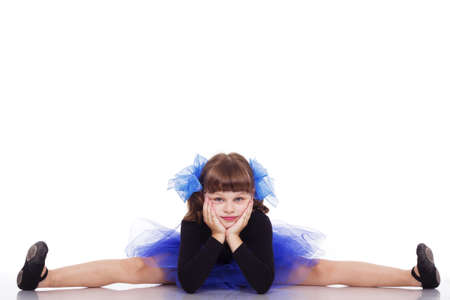 Little dancer in a beautiful blue dress, isolated on a white backgroundの写真素材
