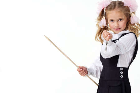 Portrait of a first grader in a school uniform on a white background.の写真素材