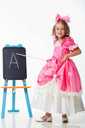 Little Beauty Queen. Young girl as magic fairy on white backgroundの写真素材