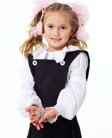 Cute little school girl with new keysの写真素材