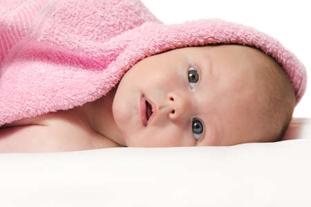 Baby girl After Bath Wrapped in Red Towel Laying and Posingの写真素材