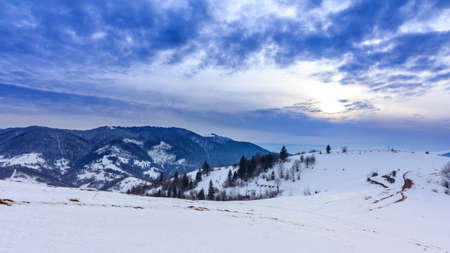 Mountain peak with snow blow by wind. Winter landscape. Cold day, with snow.の写真素材