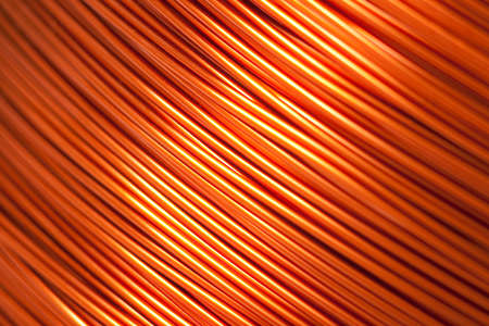Copper wire for electronics close-up with a focus on the center and blurred edges of the right and left. Designed for the production of electronic components in the electrical industry.の写真素材
