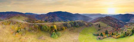 Ukraine. Sunrise shines in the Carpathians, colored fog spreads over the valleys and lowlands of the mountain range, golden prairies are very dazzlingly beautiful.の写真素材