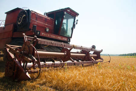 Modern tractor in the field with complex for the plowing. The concept of work in a fields and...