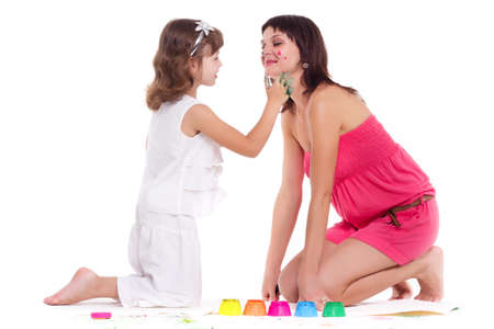 beautiful mommy and her kid paintig a picture for kindergardern. hobby, education, development , child developing painting skills. close up photoの写真素材