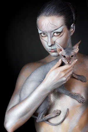 european model in cat make-up and bodyartの写真素材