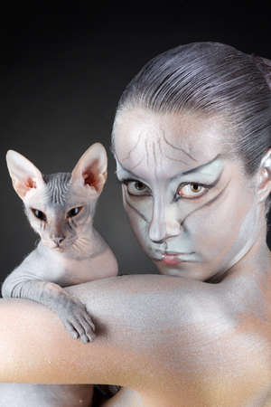 european model in cat make-up and bodyartの写真素材