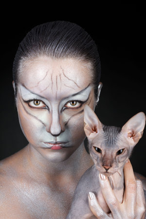 european model in cat make-up and bodyartの写真素材