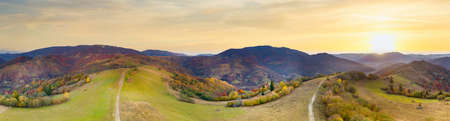 Ukraine. Sunrise shines in the Carpathians, colored fog spreads over the valleys and lowlands of the mountain range, golden prairies are very dazzlingly beautiful.の写真素材