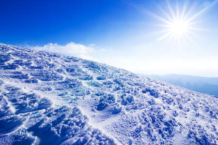 Amazing winter snowy scenery of famous and popular touristic landmark - old desolate observatory on mountain Pip Ivan in Chornogora mountain ridge in Ukrainian Carpathian national park.の写真素材