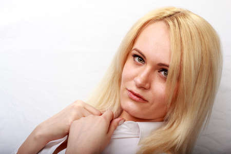 Closeup portrait of young beautiful woman blond girl with long straight hair with natural makeup. Vogue style portait. Hairstyle and skincare and cosmetics conceptの写真素材