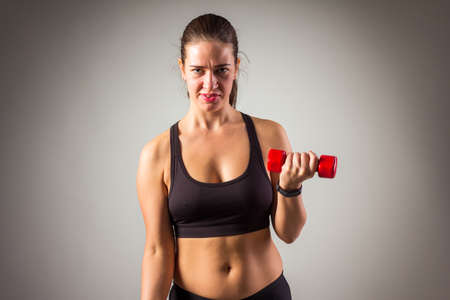Fitness woman working out on the floor isolated on a white backgroundの写真素材