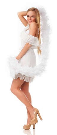 fashionable womans face surrounded by white feathersの写真素材