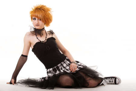 Portrait of a fantasy gothic red-haired witch. Bizarre red hair Gothic Girl. Studio shot.の写真素材
