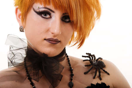 Portrait of a fantasy gothic red-haired witch. Bizarre red hair Gothic Girl. Studio shot.の写真素材