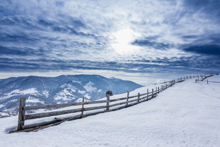 Mountain peak with snow blow by wind. Winter landscape. Cold day, with snow.の写真素材