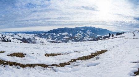 Mountain peak with snow blow by wind. Winter landscape. Cold day, with snow.の写真素材