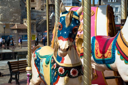 Horses on a traditional fairground vintage carousel